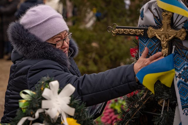 <p>An elderly resident of Bakhmut cries as she marks the anniversary of Russia’s invasion of Ukraine</p>