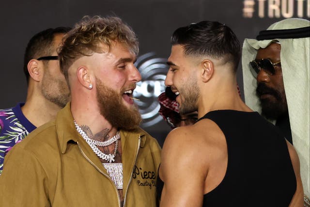 <p>Jake Paul (centre-left) faces off with Tommy Fury at a pre-fight press conference</p>