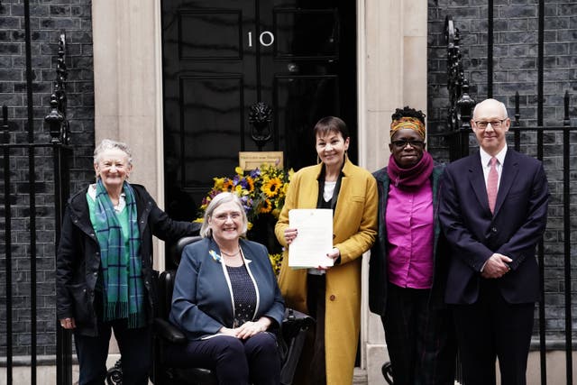 A cross-party group of parliamentarians including Caroline Lucas and Rosamund Adoo-Kissi-Debrah handed in a letter urging the Prime Minister to support the Clean Air Bill (Jordan Pettitt/PA)