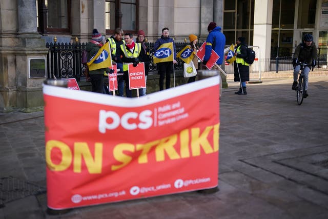 Members of the PCS union on the picket line outside Victoria Square House in Birmingham (Jacob King/PA)