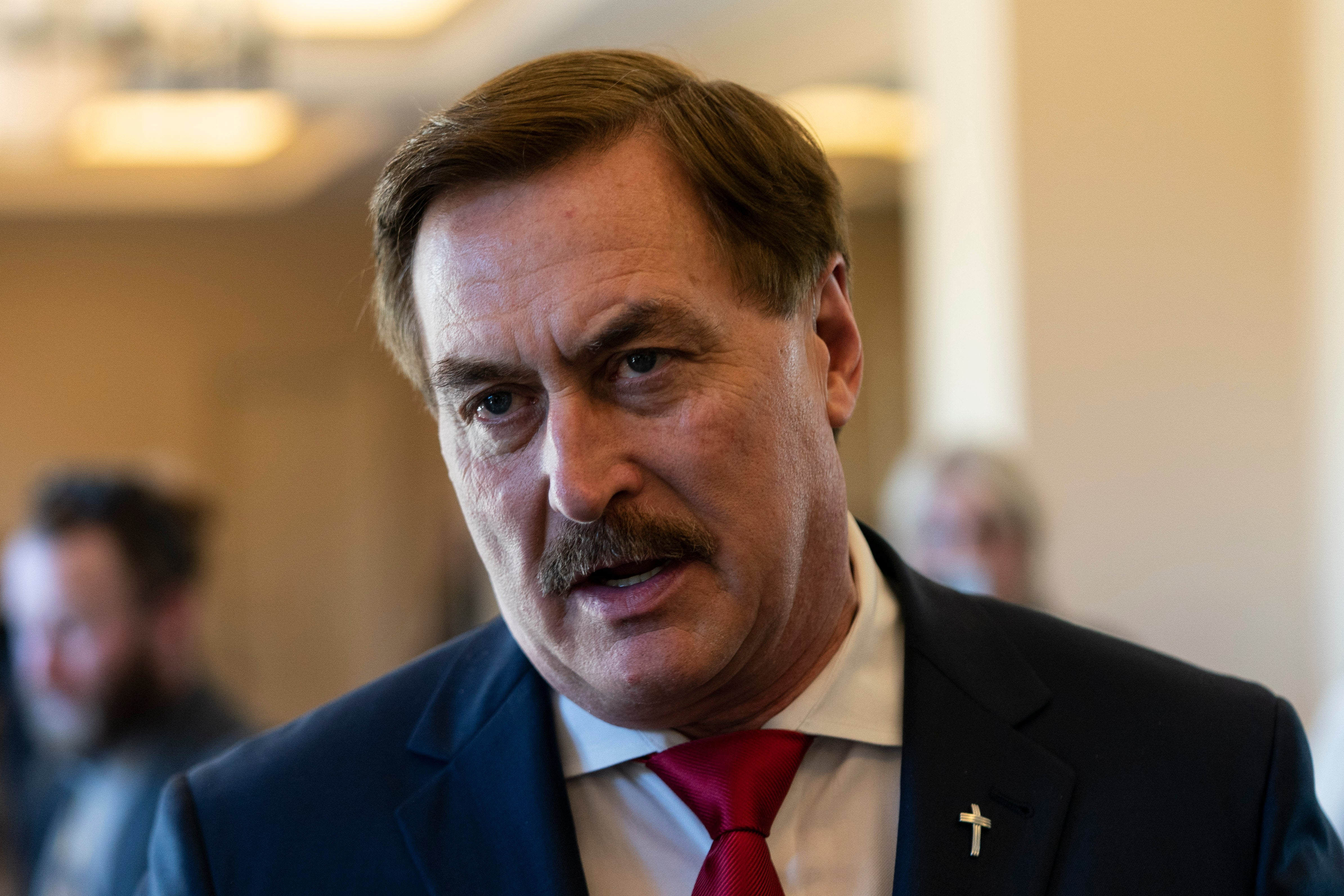 Mike Lindell talks to reporters at the Republican National Committee winter meeting
