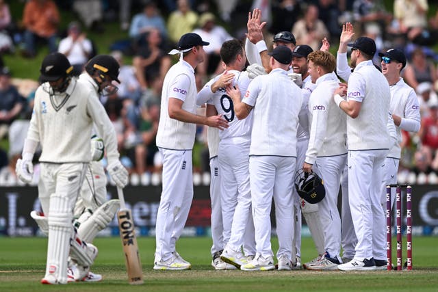 England players celebrate the wicket of Devon Conway (Andrew Cornaga/AP)