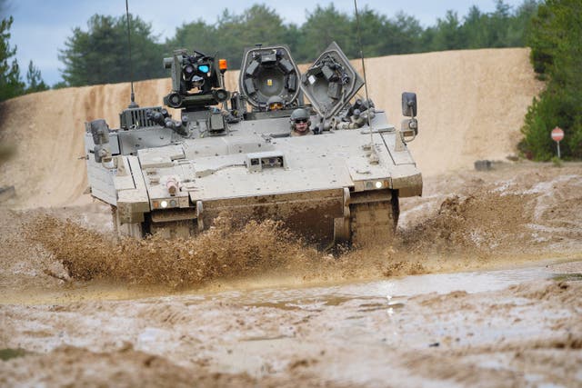 <p>An Ajax Ares tank, an armoured personnel carrier, on the training range at Bovington Camp, a British Army military base in Dorset, during a visit by Defence Secretary Ben Wallace. Picture date: Wednesday February 22, 2023.</p>
