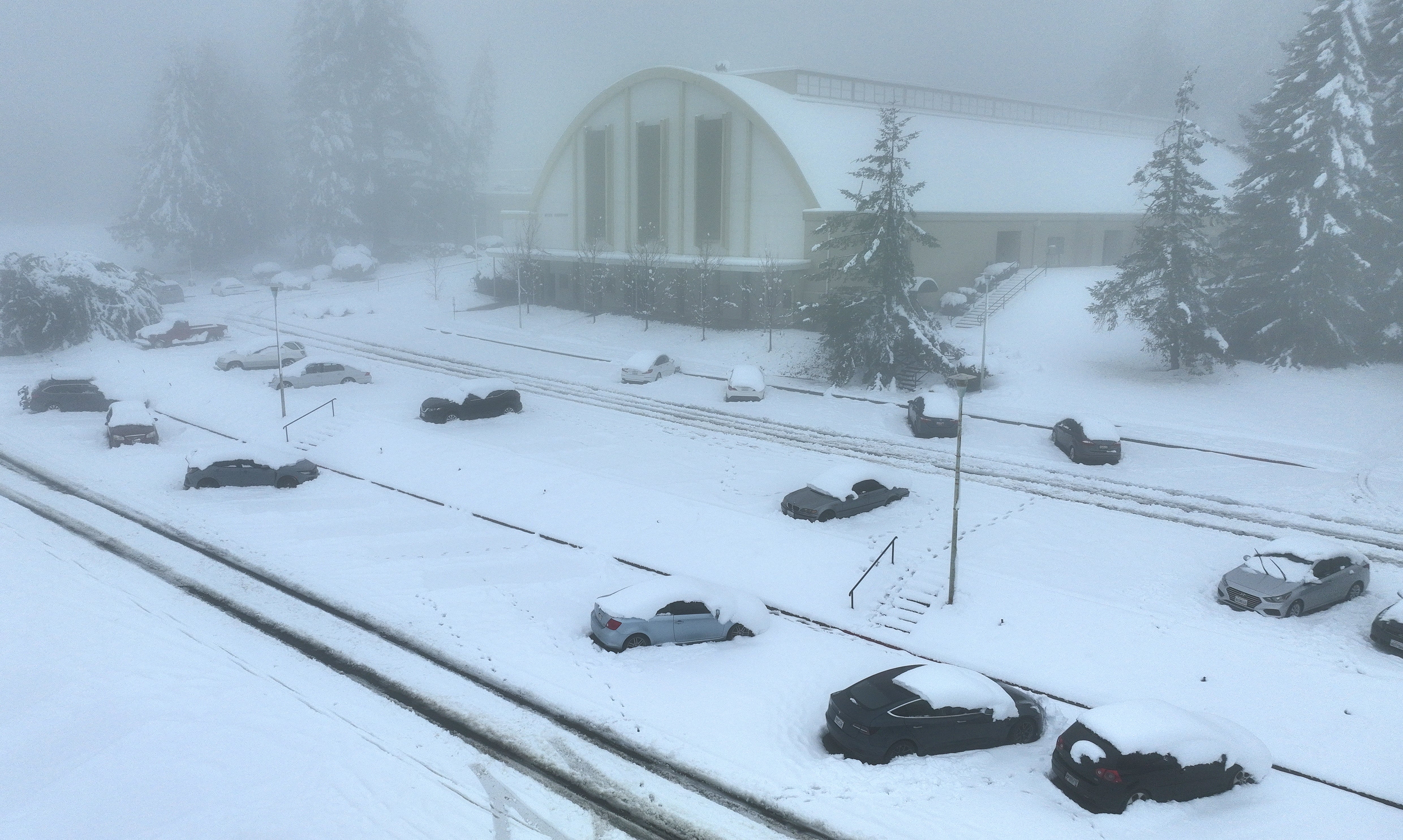 Cars are seen covered in snow at Pacific Union College in Angwin, California