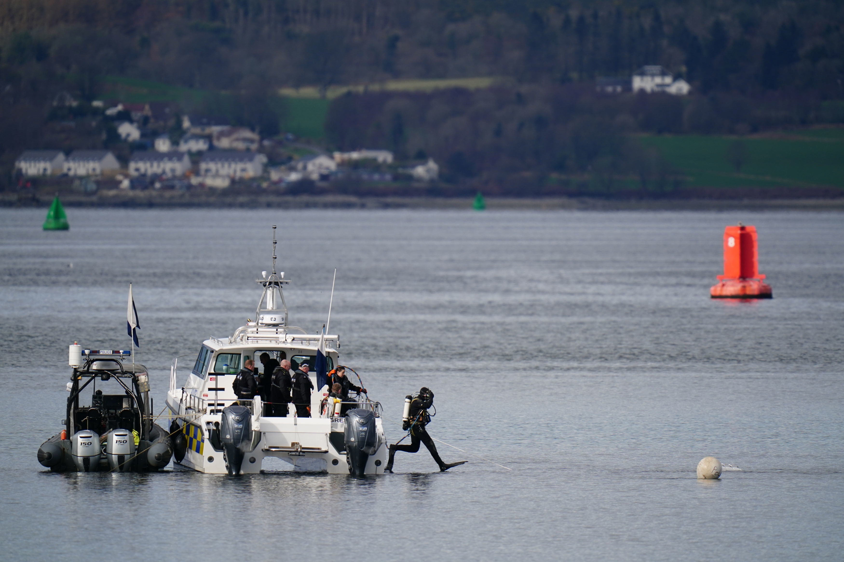 Police boats and divers taking part in the rescue operation in the Firth of Clyde