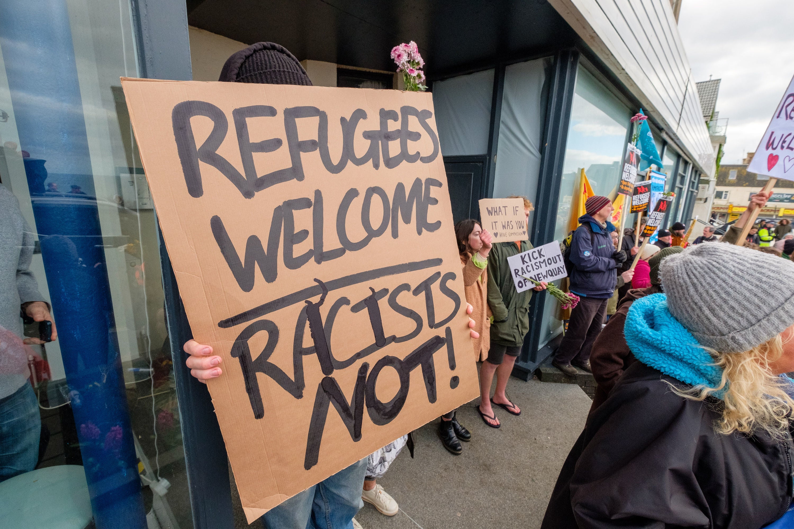 Anti-fascists from Cornwall Resists, stand outside a hotel in Cornwall which houses refugees