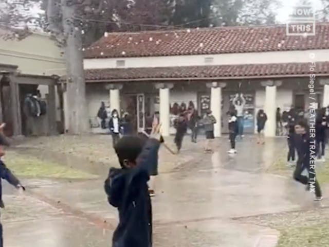 <p>Second graders in Pasadena enjoy a hail storm brought by a massive weather system that blanketed California in snow and heavy rains</p>