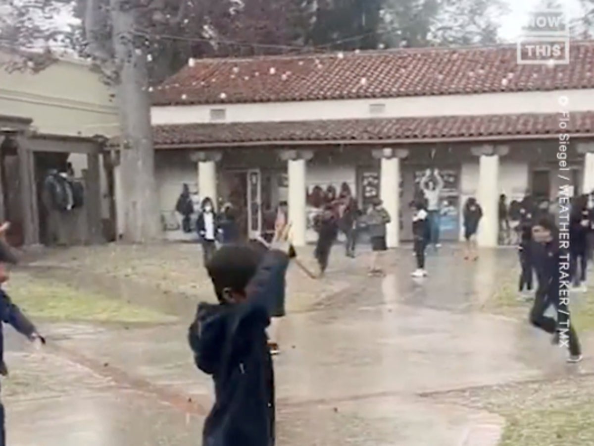 Video captures excited schoolchildren in California enjoying the novelty of playing in hailstorm