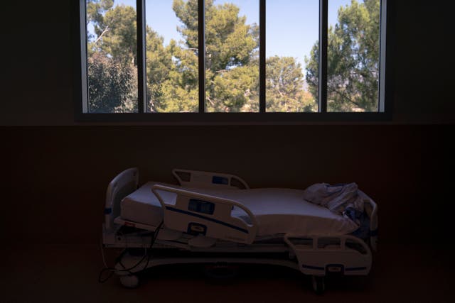 <p>A hospital bed is seen in a COVID-19 unit at Providence Holy Cross Medical Center in Mission Hills, California </p>