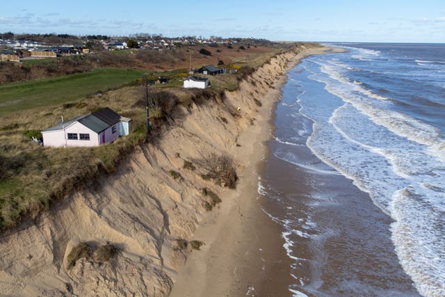 Homes sit close to the cliff edge at Hemsby in Norfolk, where the beach has been closed because of erosion (Joe Giddens/PA Wire)