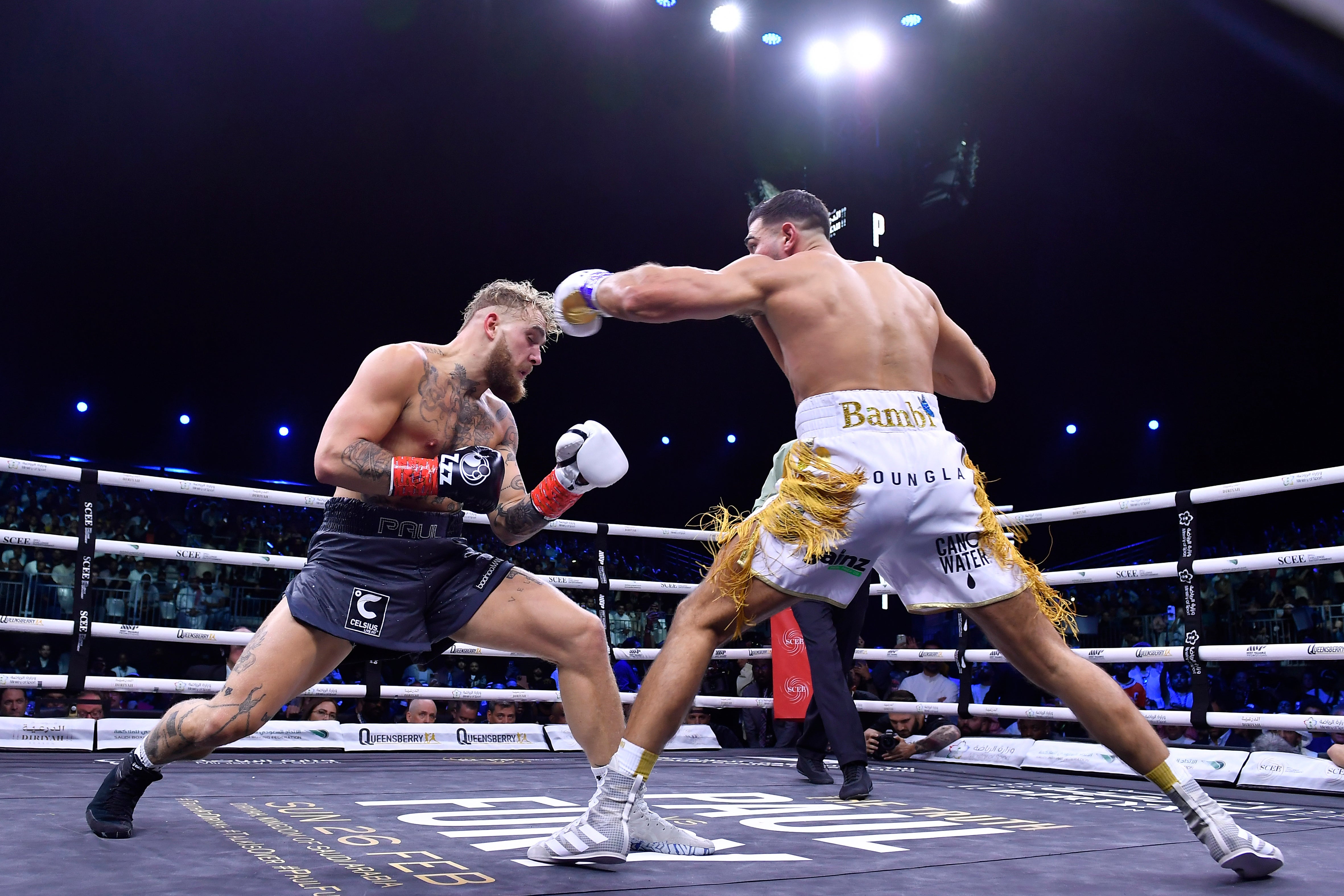 Jake Paul (left) suffered a first loss as a boxer, as he came up short on points