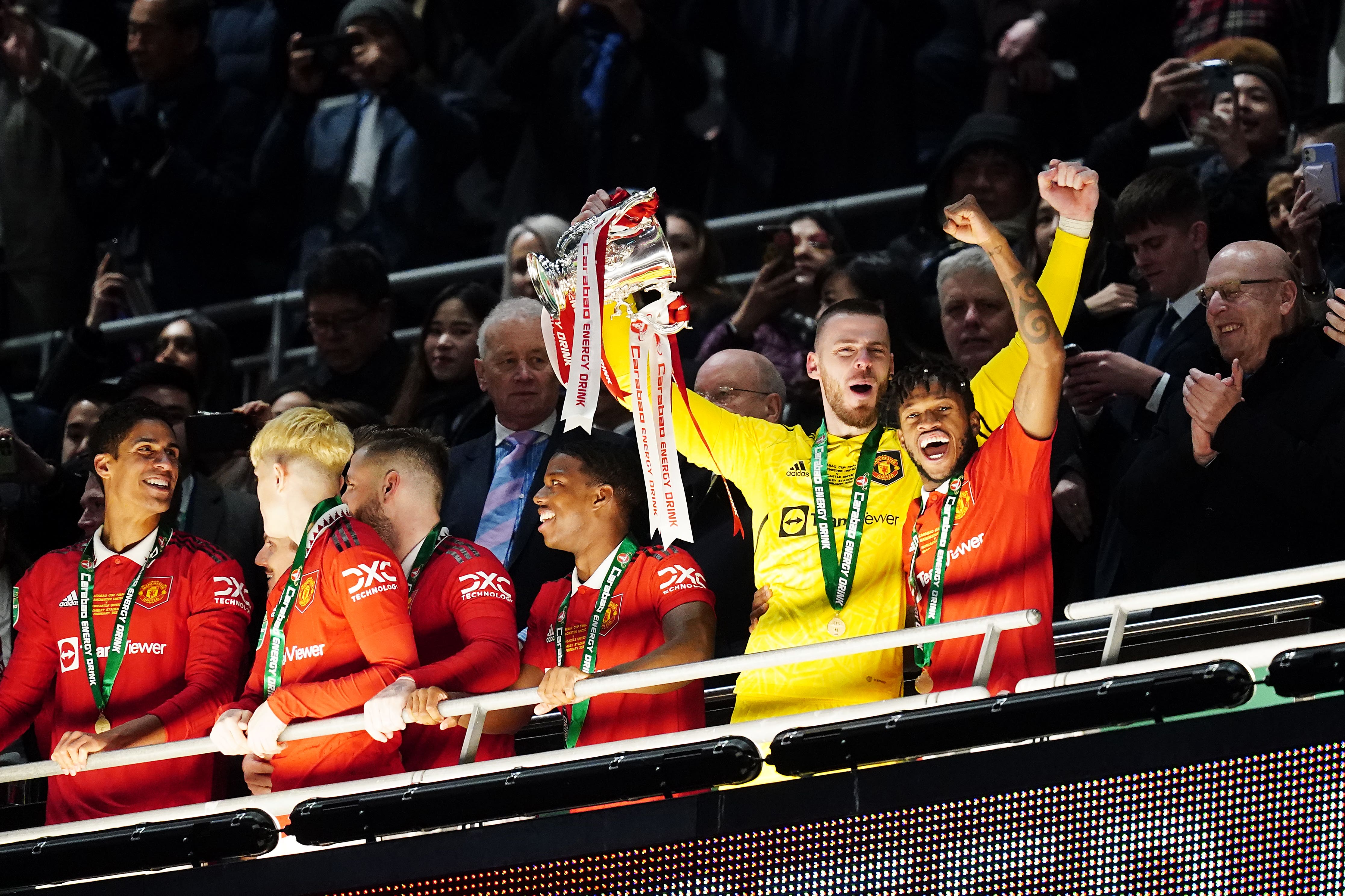 David de Gea (left) and Fred celebrate with the trophy (David Davies/PA)