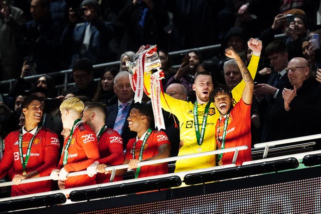 David de Gea (left) and Fred celebrate with the trophy (David Davies/PA)