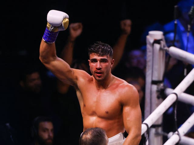 <p>Tommy Fury celebrates after he won by split decision against Jake Paul</p>