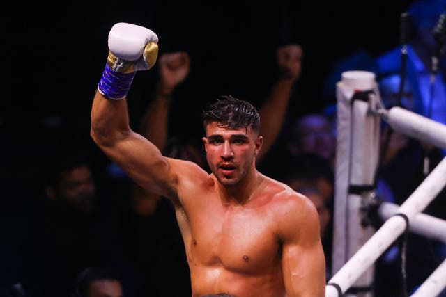 <p>Tommy Fury celebrates after he won by split decision against Jake Paul</p>