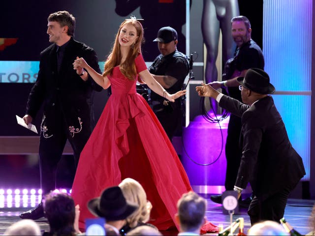 <p>Jessica Chastain receives help from Paul Mescal (left) and Courtney B Vance after tripping while walking onstage to accept her SAG Award</p>