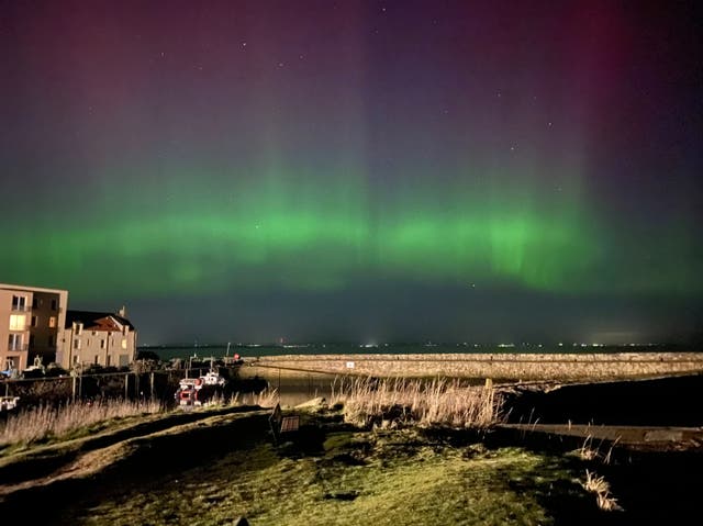 <p>Aurora stretching across the night sky in St Andrews</p>