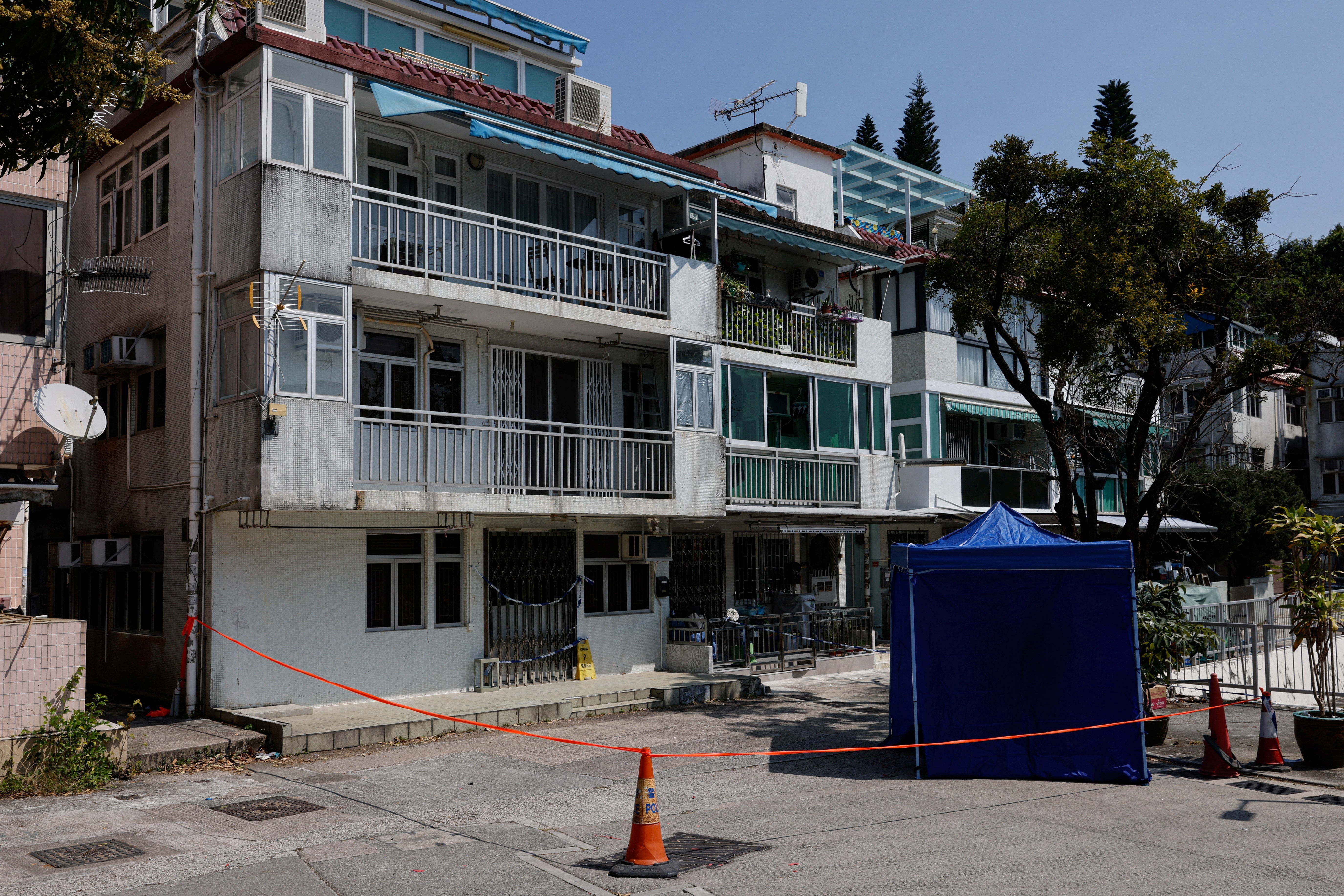 Cordons lines are seen outside a village house where part of Abby Choi's body was found in Hong Kong