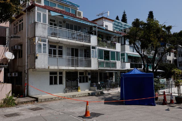 Cordons lines are seen outside a village house where part of Abby Choi's body was found in Hong Kong