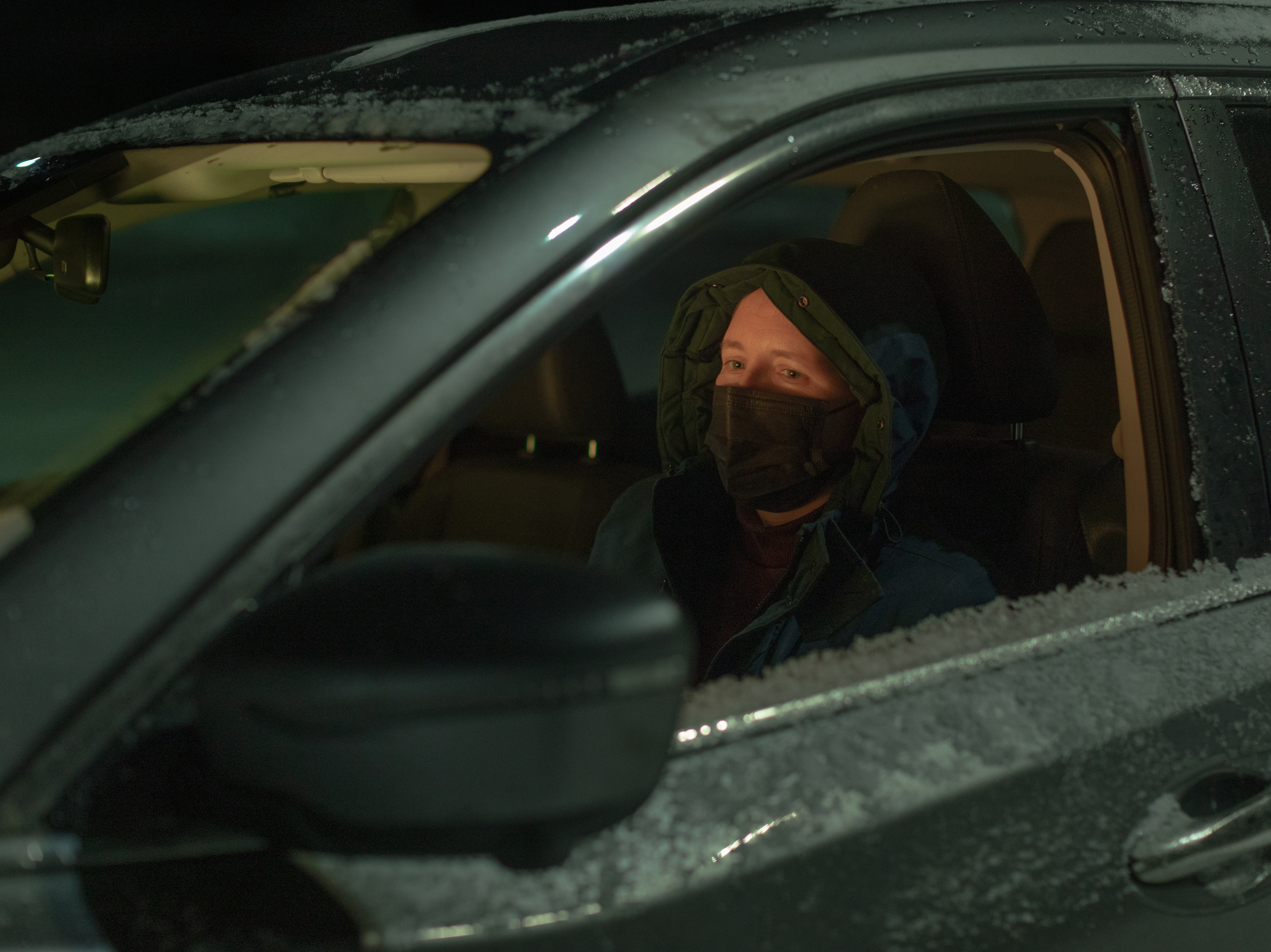 A volunteer in her car on the highway towards Finland