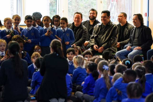 Pupils at St Edward’s Catholic Primary School in Birmingham, perform for members of UB40. (Jacob King/PA)