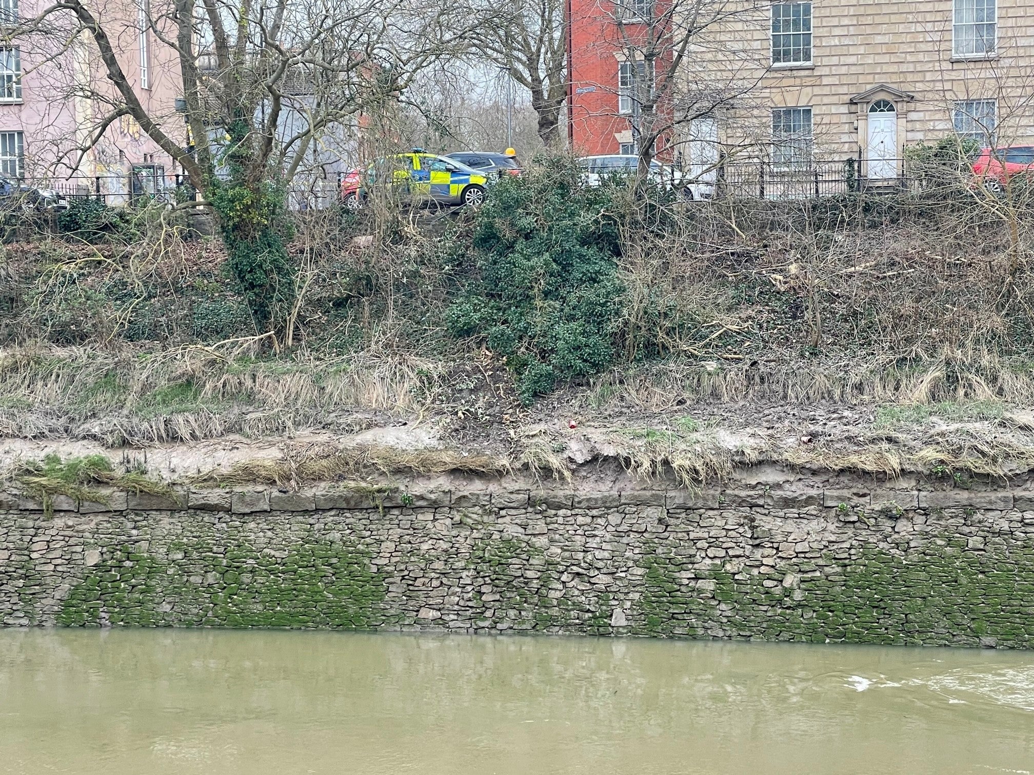 The scene in the Bedminster area of Bristol after a car went through railings and into the River Avon