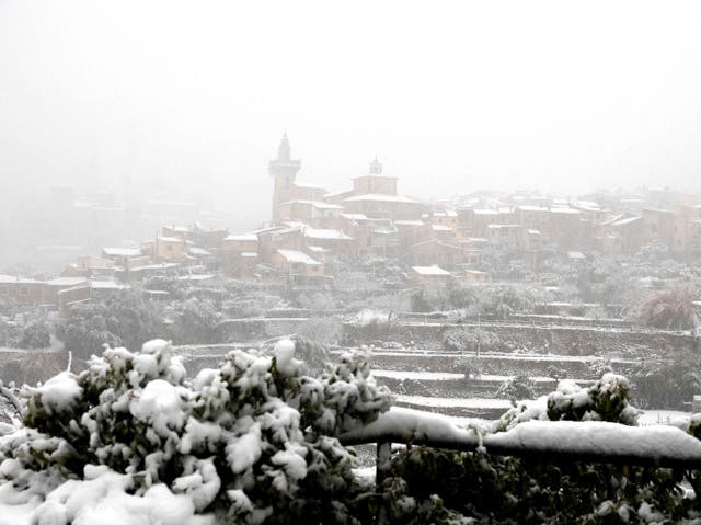 <p>The mountain village of Valldemossa covered in snow, on the Spanish Balearic island of Mallorca</p>