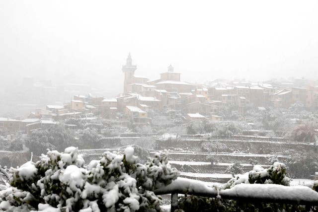 <p>The mountain village of Valldemossa covered in snow, on the Spanish Balearic island of Mallorca</p>