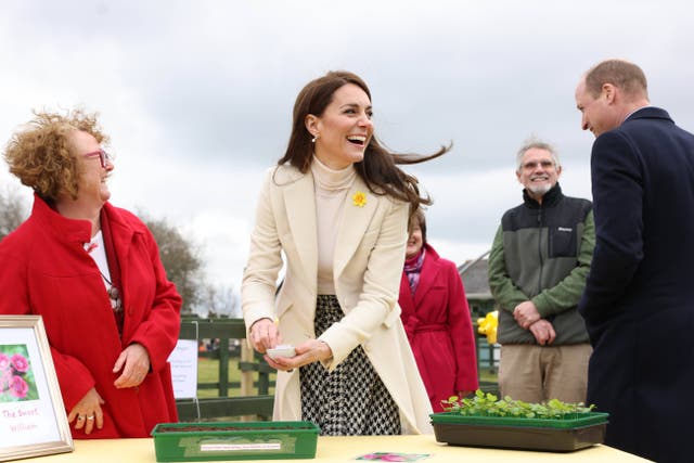 The Princess of Wales laughs as she plants Sweet William seeds with the Prince of Wales (Ian Vogler/Daily Mirror/PA)
