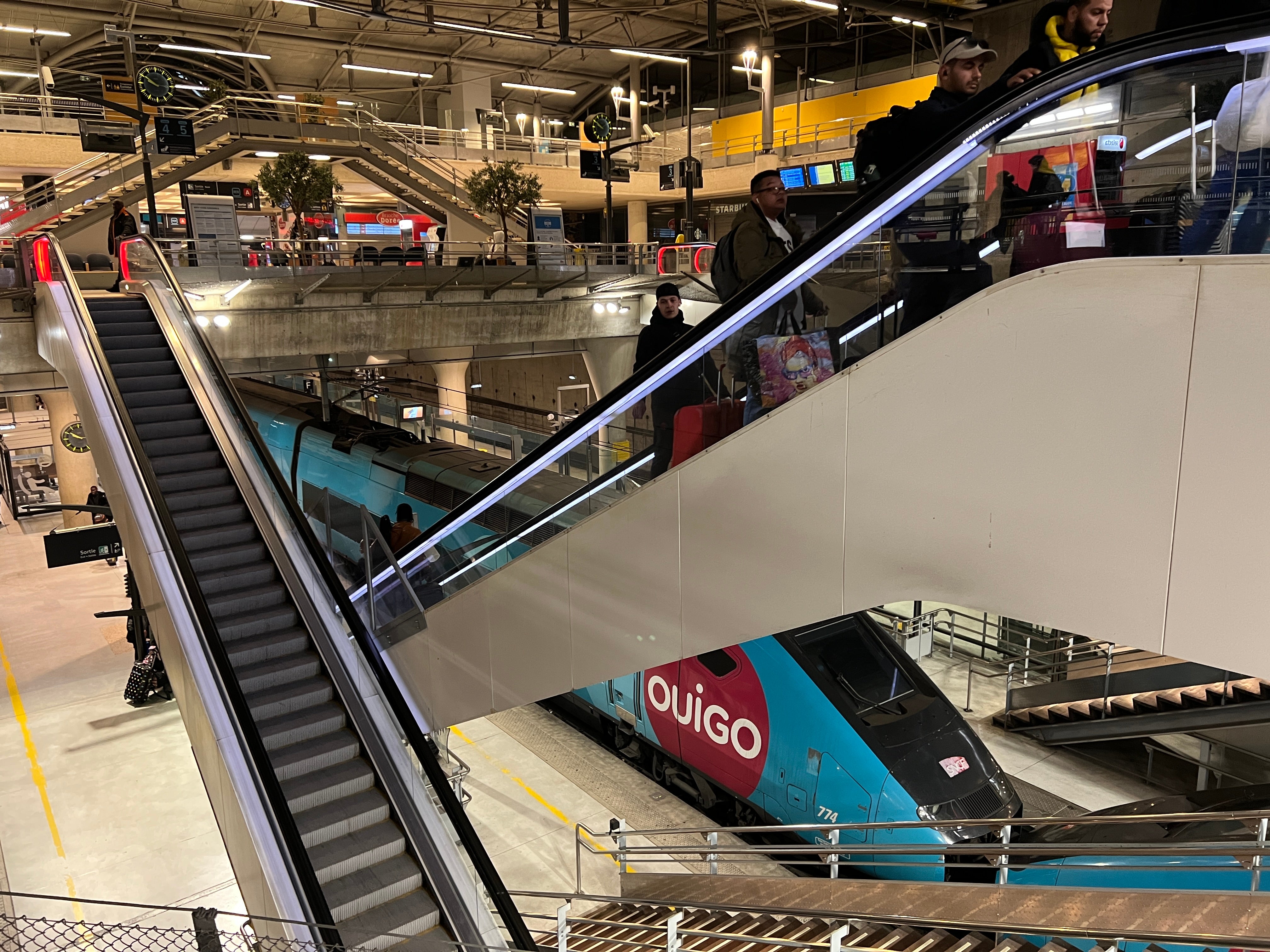 <p>Is this Paris? Passengers leaving the Ouigo express train from the south at Marne-la-Vallée station, some way east of the French capital</p>