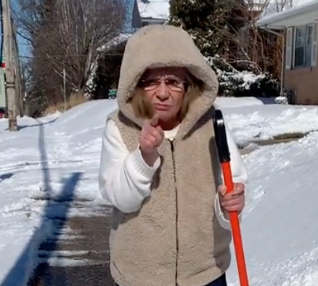 <p>A woman upset with two men who shoveled her sidewalk in Rockford, Illinois</p>