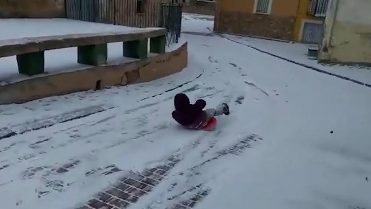 Children play in snowy Spanish province as Storm Juliette hits