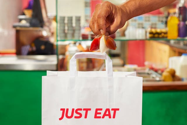 Online food delivery firm Just Eat Takeaway.com has said it returned to underlying earnings in 2022 despite seeing a drop in orders as customers cut back and expects to remain profitable in 2023(Just Eat/PA)