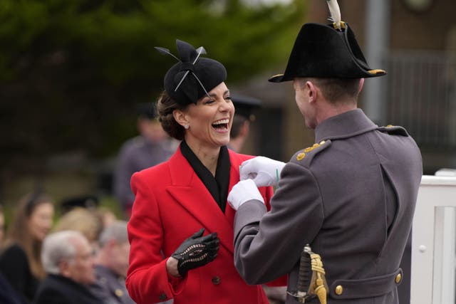 The Princess of Wales laughs as she is presented with a leek corsage (Alastair Grant/PA)