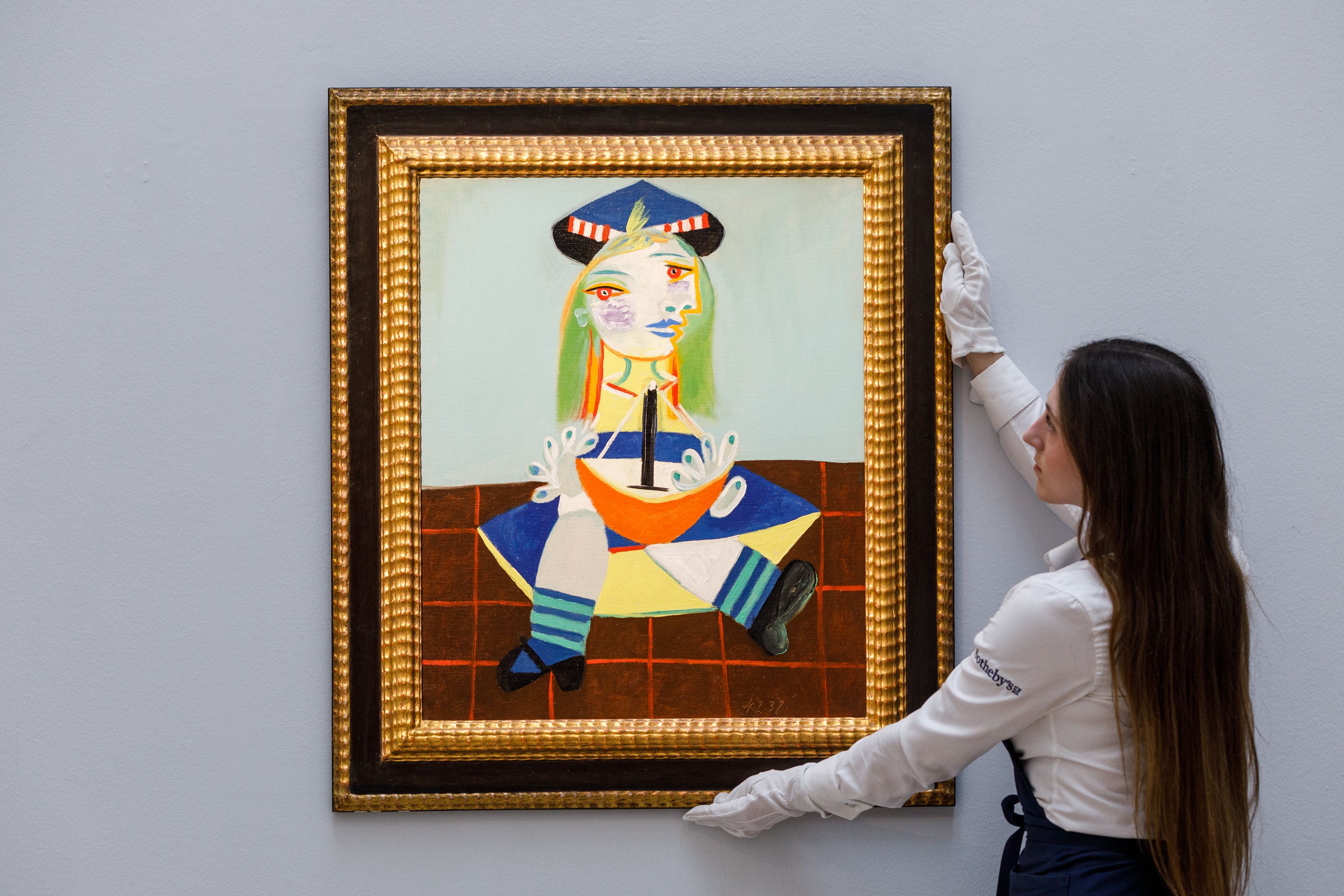 A portrait by Pablo Picasso of his daughter Maya has sold for more than £18 million at auction