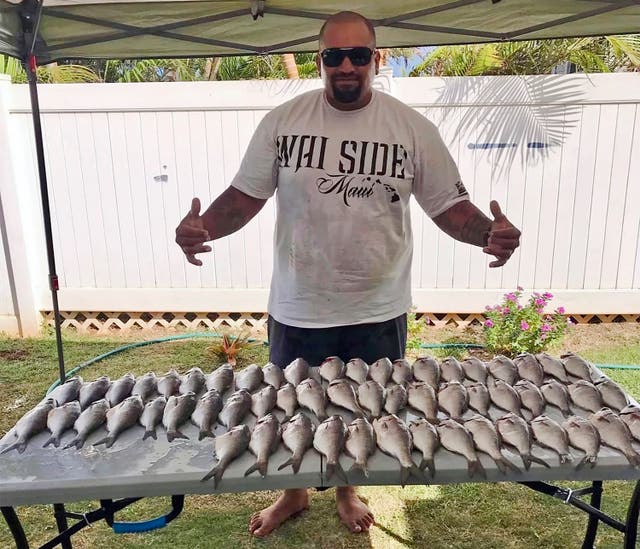 <p>Kaulana Alo-Kaonohi poses with fresh fish caught off Kahakuloa village in Wailuku</p>