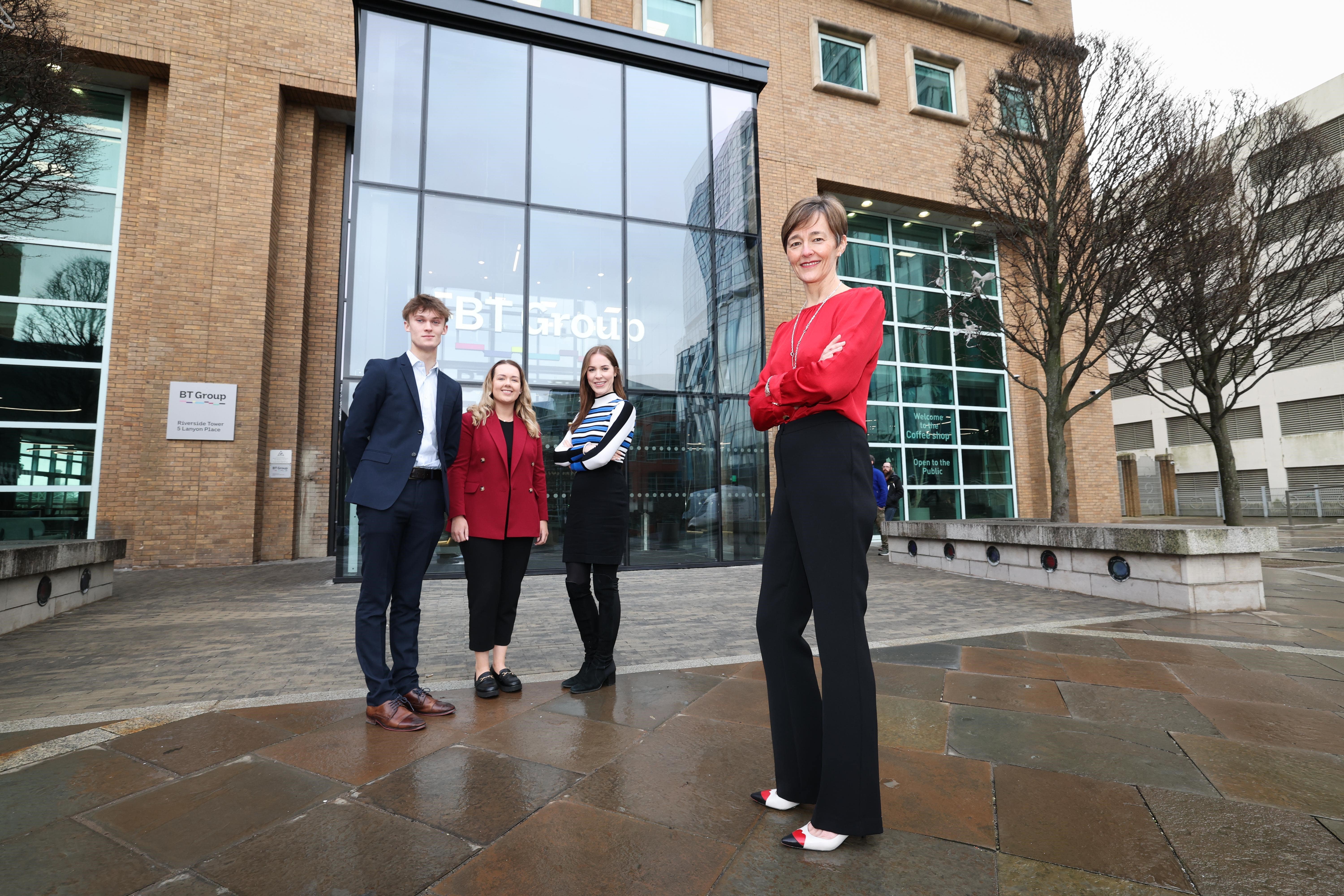 BT programme director Sue Glew with employees outside the newly refurbished Riverside Tower (Kelvin Boyes/Press Eye/PA)