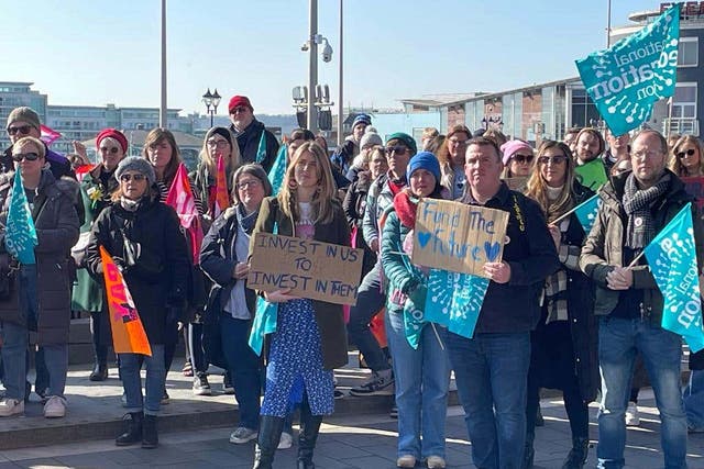 NEU members rallied outside the Senedd in Cardiff Bay (PA)