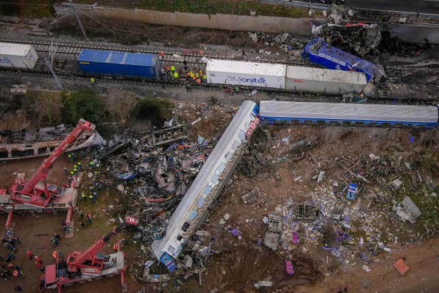 <p>Emergency crews searching wreckage after the train crash near Larissa, Greece</p>