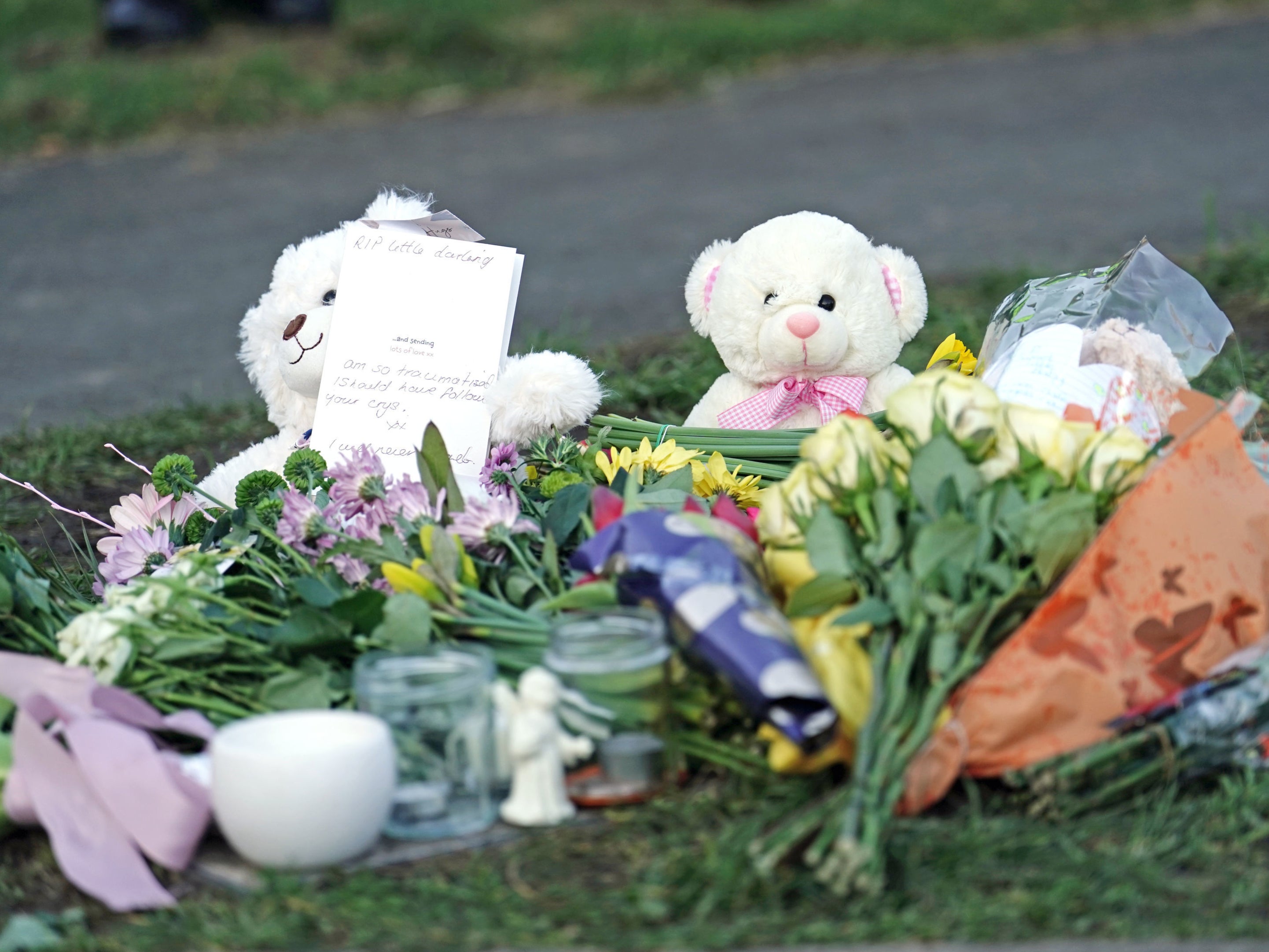 People left flowers and teddy bears in Golf Drive, Brighton, after the remains were found
