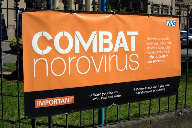 Combat norovirus sign (Alamy/PA)