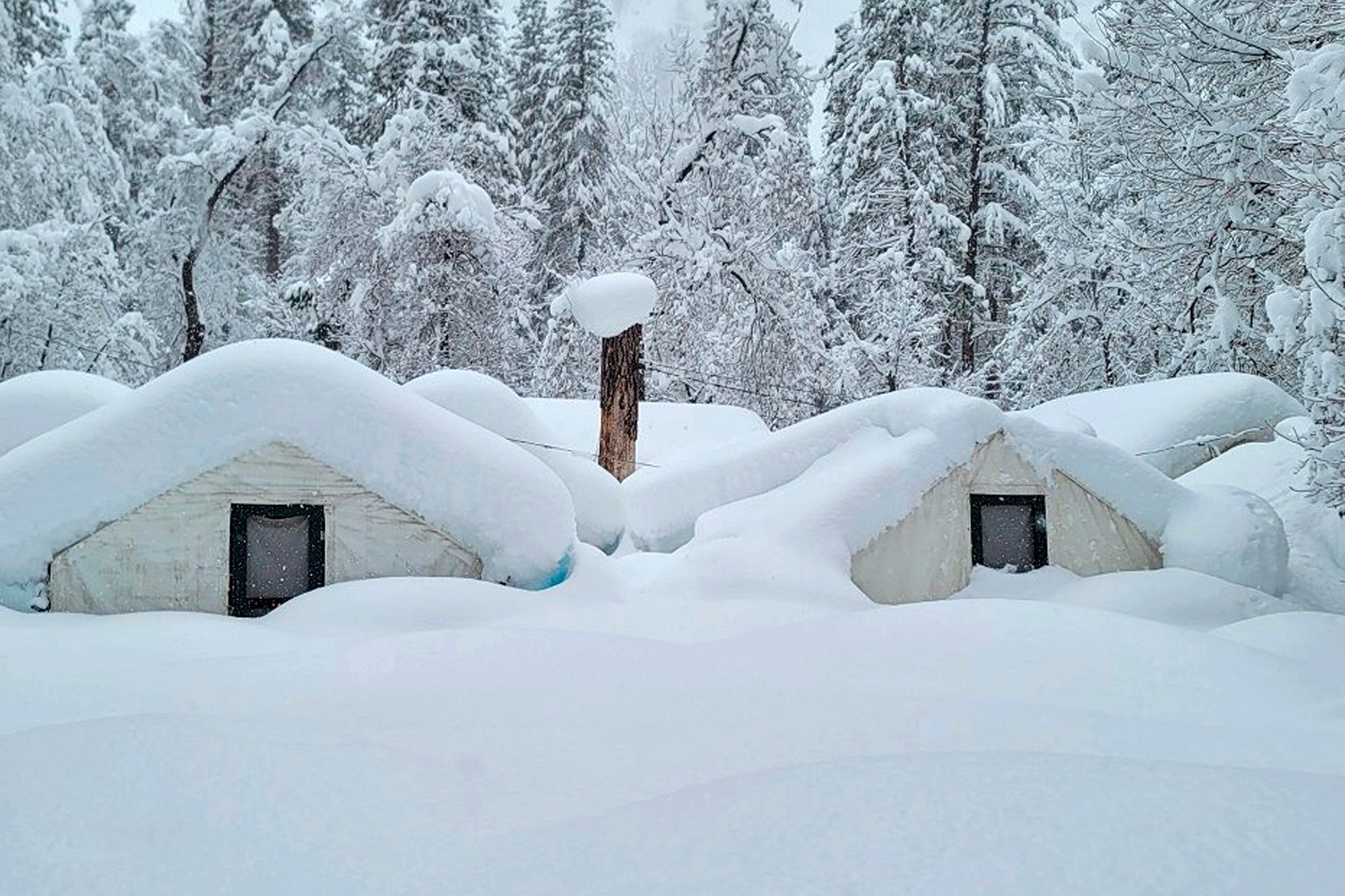 In this photo provided by the National Park Service, tents at Curry Village are covered with snow in Yosemite National Park, California on February 28, 2023