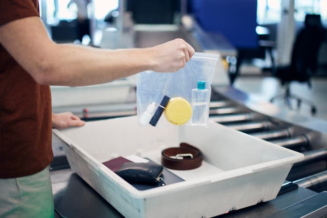 <p>Current restrictions mean passengers must decant liquids into small plastic bags to pass through airport security</p>