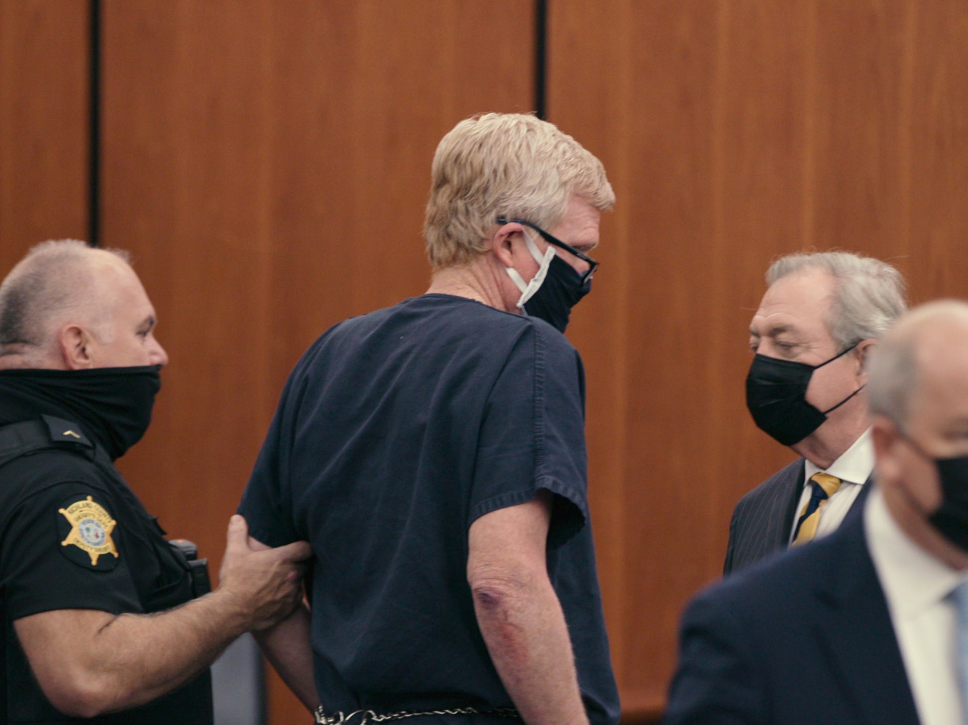Alex Murdaugh (centre) in custody