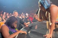 ‘I need a hug too’: Lizzo hugs crying fan in crowd at Milan show