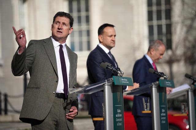 Minister for Environment Eamon Ryan (left) with Taoiseach Leo Varadkar and Tanaiste Micheal Martin at Government Buildings in Dublin. (PA)
