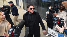 Stephen Bear poses for selfies and sings outside court before revenge porn sentencing