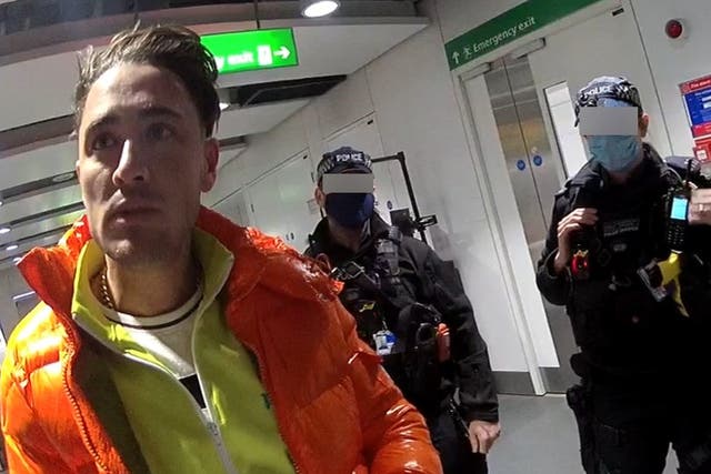 <p>Stephen Bear being arrested at Heathrow Airport</p>