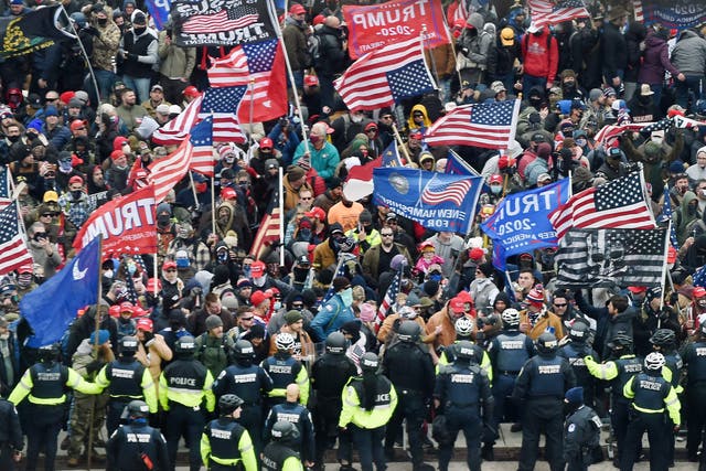 <p>Trump supporters clash with police and security forces as they storm the US Capitol in Washington, DC on January 6, 2021</p>