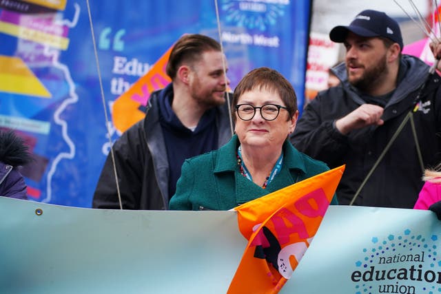 Mary Bousted, joint general secretary of the National Education Union, joins members at a rally in central Manchester (Peter Byrne/PA)